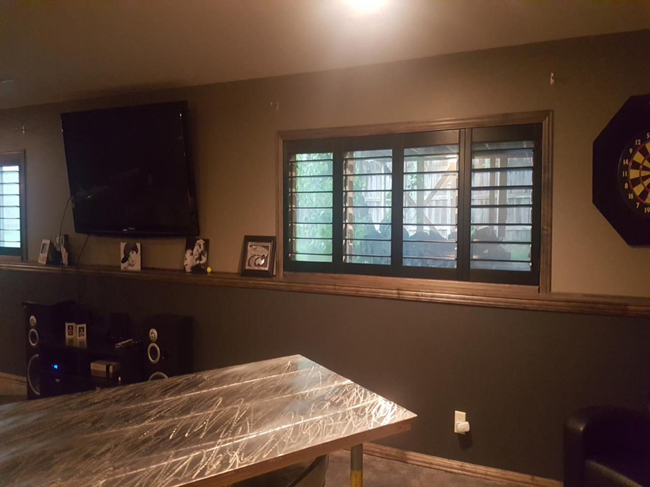 Rec room with stained plantation shutters