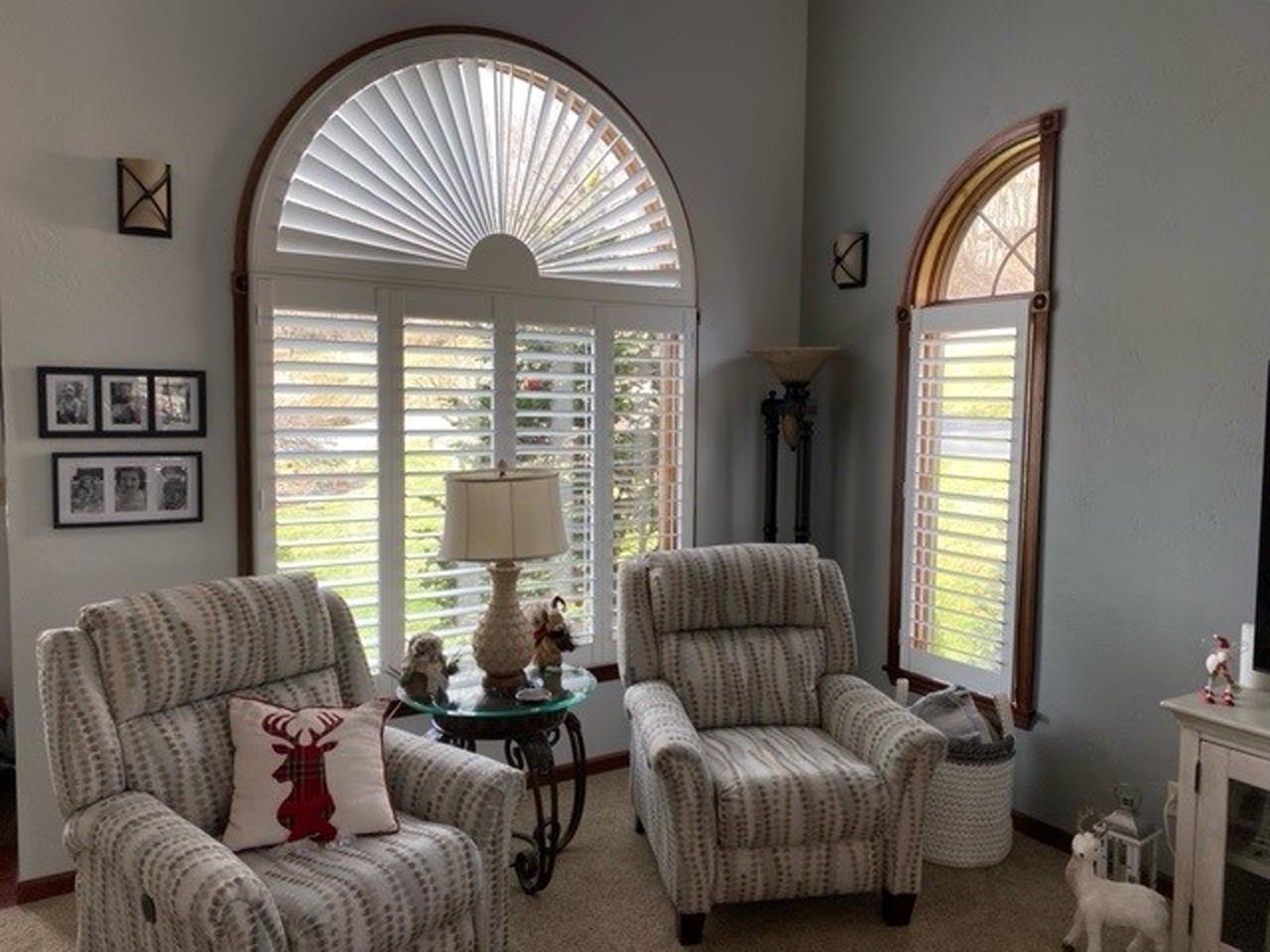 Heritage shutters on arched windows in den