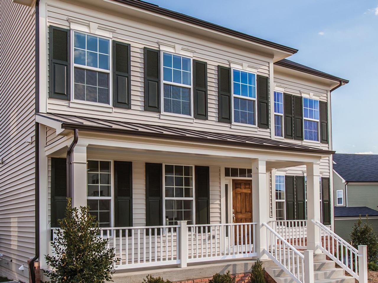 Louvered and raised panel shutters on a house