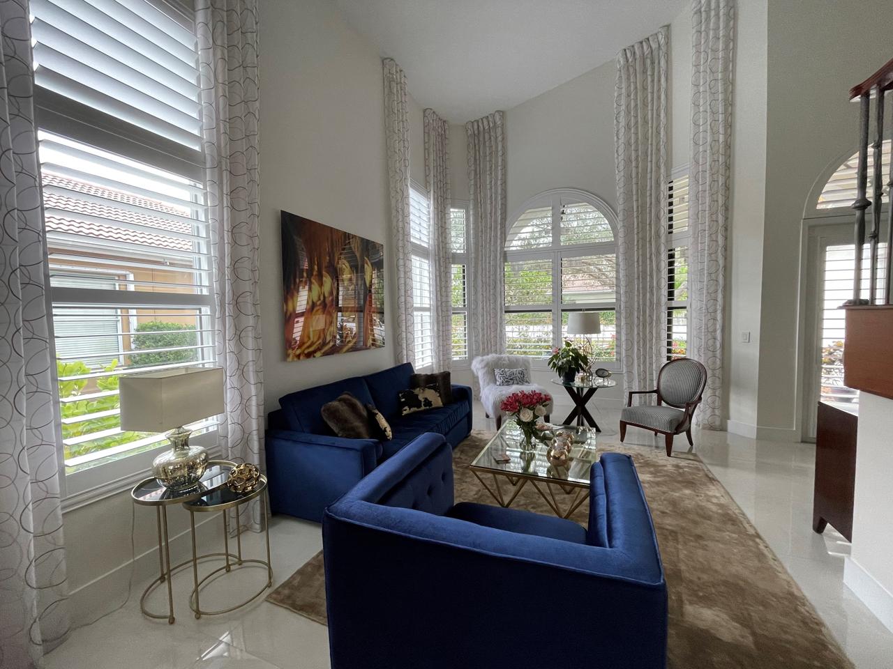 Arched window with shutters in living room