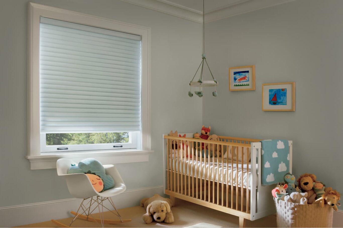 cellular roller shades on a nursery window