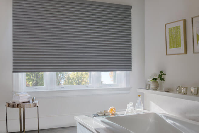 Sonnette cellular roller shades in a bathroom