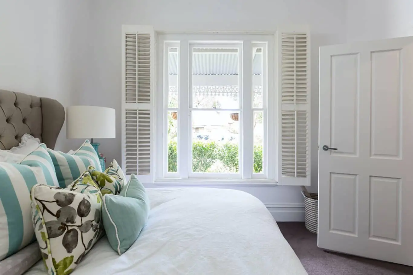 Traditional shutters on a bedroom window