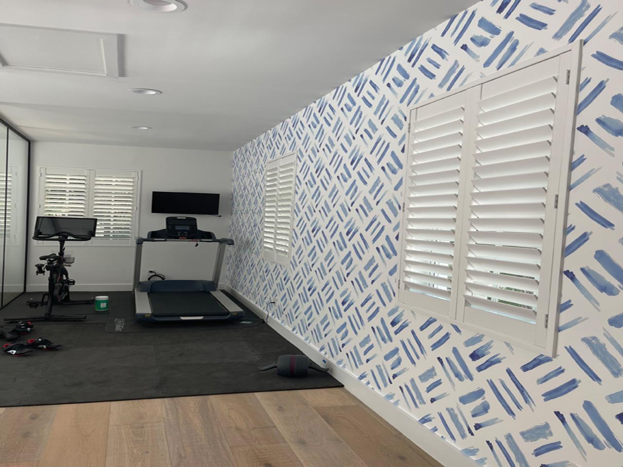 Interior shutters in workout rec room