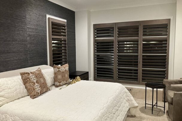 custom wood plantation shutters on bedroom windows