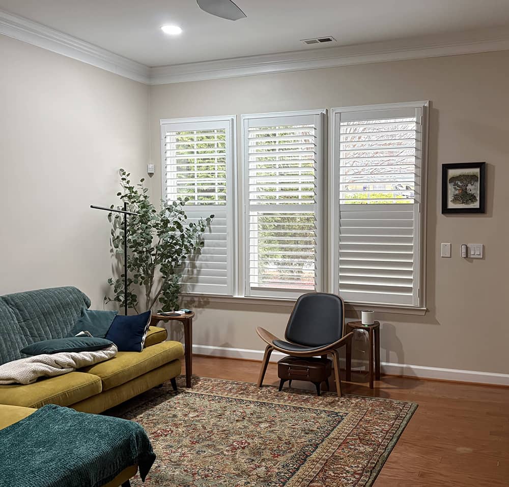 plantation shutters in 3 sections on living room window
