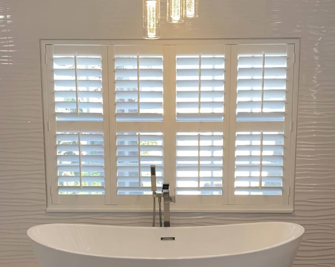 plantation shutters on bathroom windows