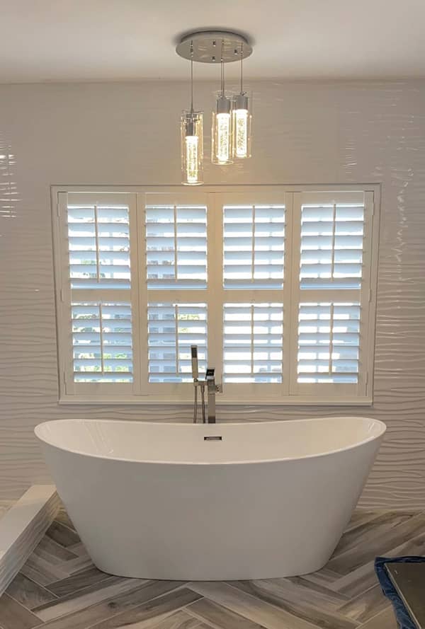 plantation shutters on bathroom windows