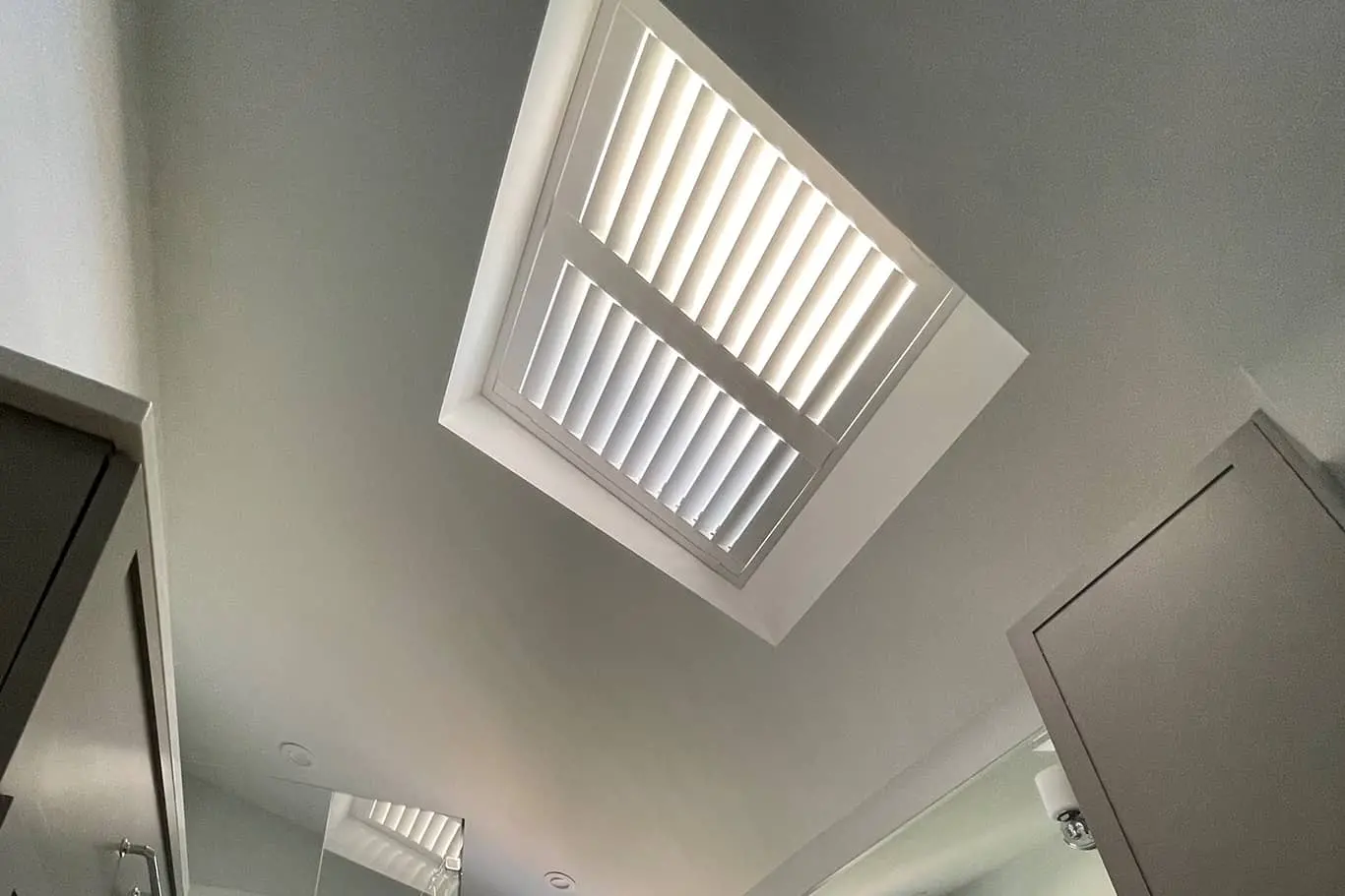 shutters on a skylight in a bathroom