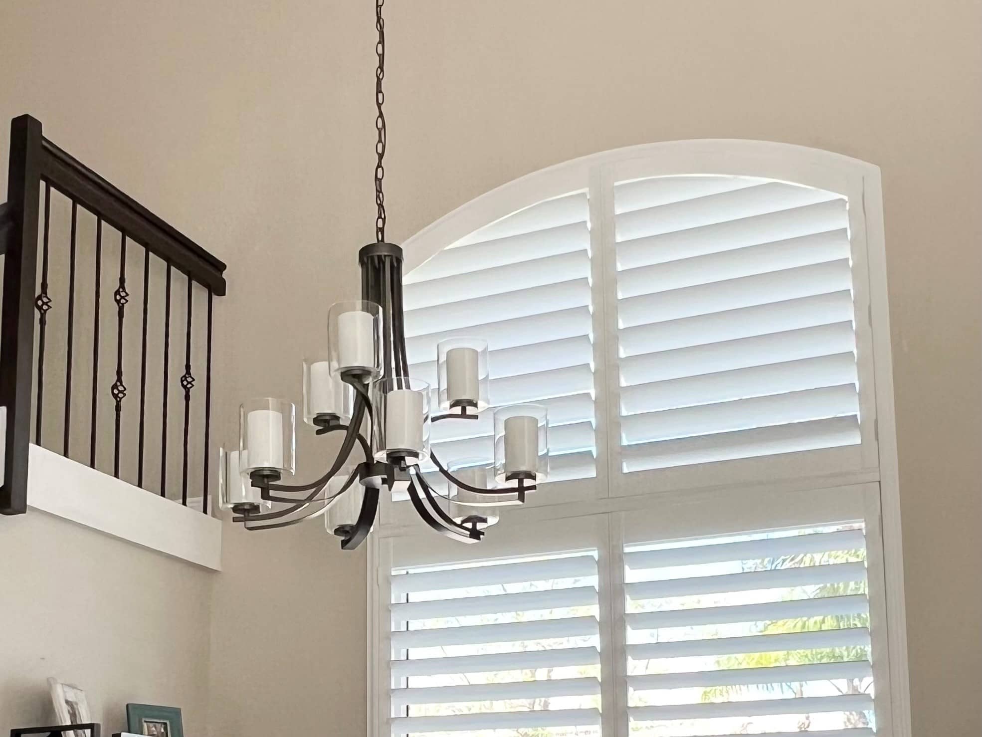 Heritage-KitchenCloseUp-1 shutters with hidden tilt rod on large, arch-topped window