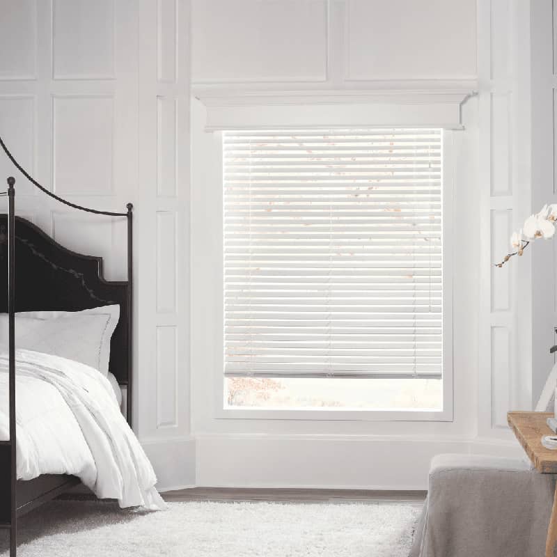 white blinds in a bright bedroom