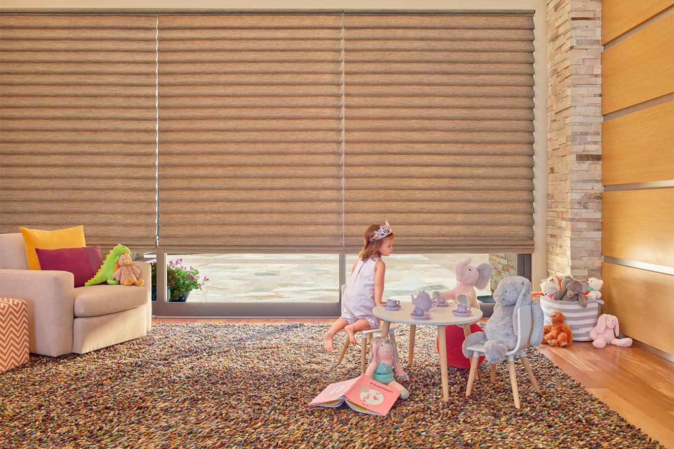 young girl playing in room with Roman shades